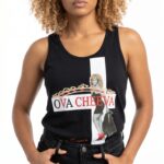 A woman with curly blonde hair wearing a black tank top featuring a graphic design and the text "OVA.