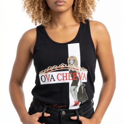 A woman with curly blonde hair wearing a black tank top featuring a graphic design and the text "OVA.