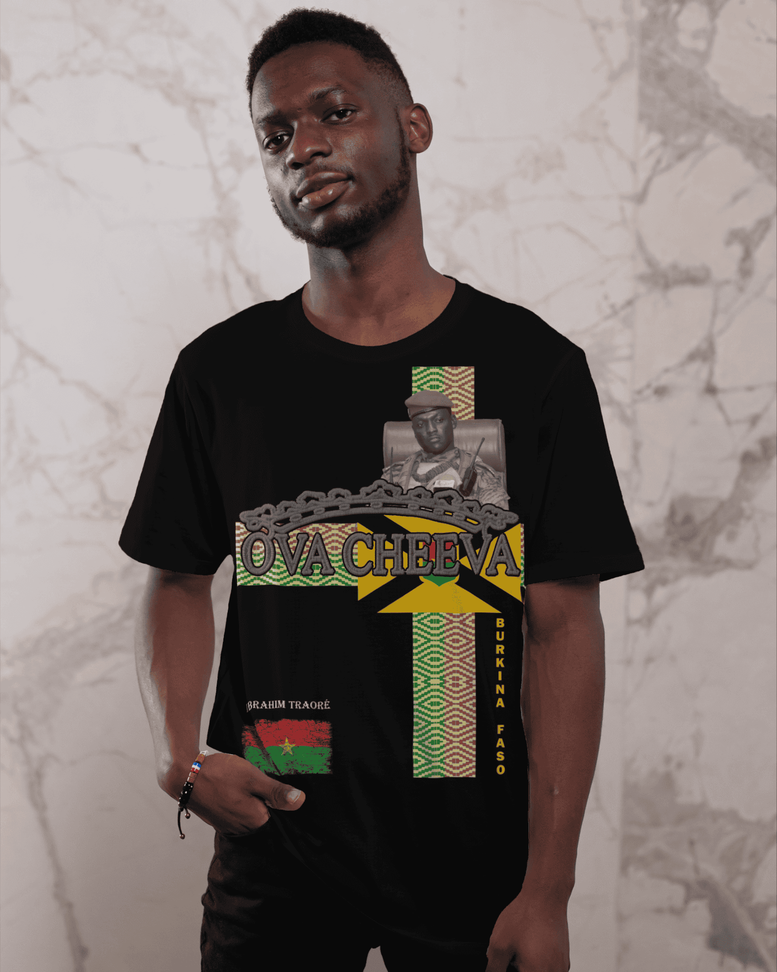 Man wearing black graphic T-shirt with "OVA CHEEVA" and Burkina Faso design.