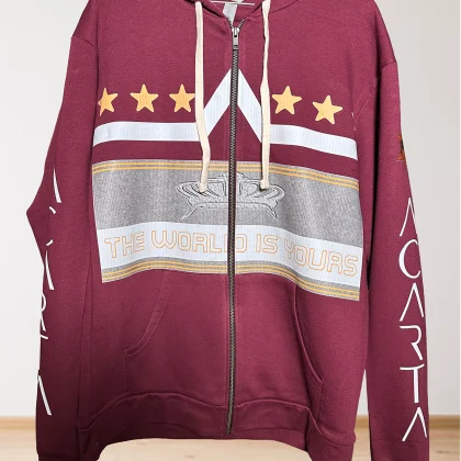 A maroon zip-up hoodie with cream drawstrings, gold stars, a gray and white graphic, and the phrase THE WORLD IS YOURS on the front. The sleeves have the word CARTA printed in white.