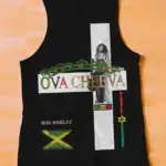 The OVA CHEEVA Women's Light Weight Tank Top features Bob Marley, the Jamaican flag, and reggae-inspired text—OVACHEEVA, BOB MARLEY, JAH LOVE, TUFF GONG—in colorful cross heart designs on a black background.
