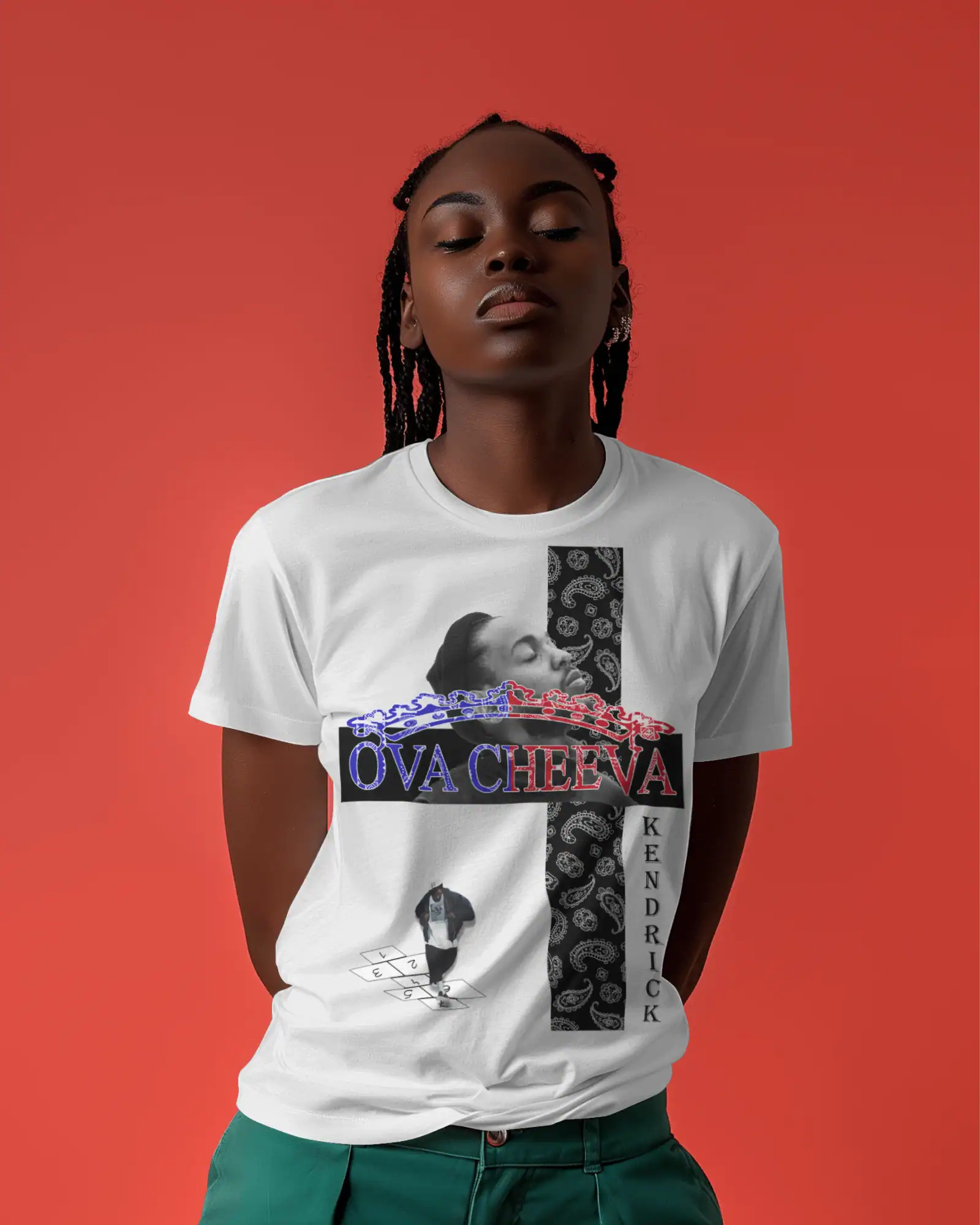 A person stands against a solid red background, hands behind their back, wearing the OVA CHEEVA Women’s Midweight Cotton Kendrick Lamar Graphic T-Shirt featuring bold designs, "OVA CHEEVA" and "KENDRICK," plus an artistic face illustration.