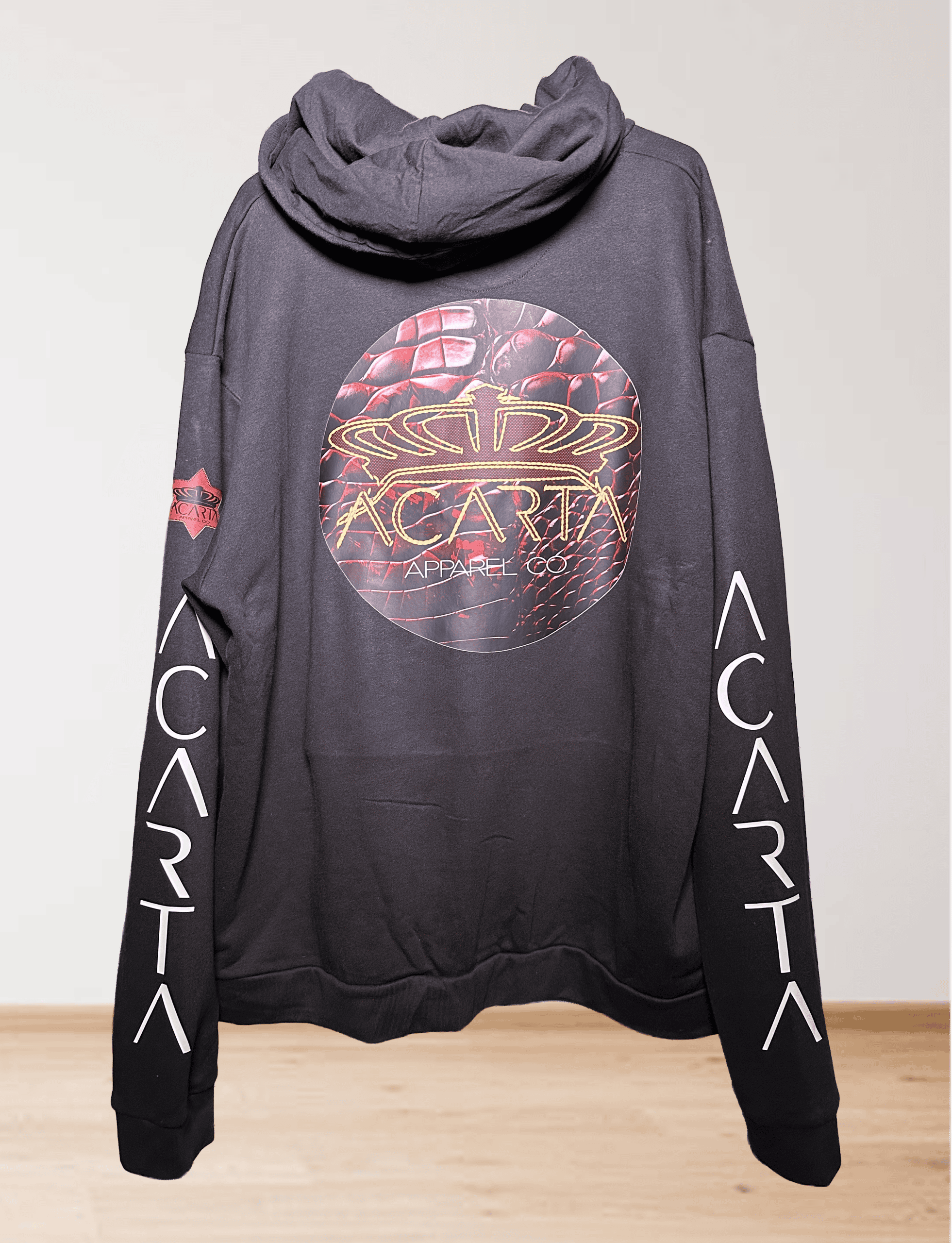Black hoodie with "ACARTA" text on sleeves and circular logo on back.