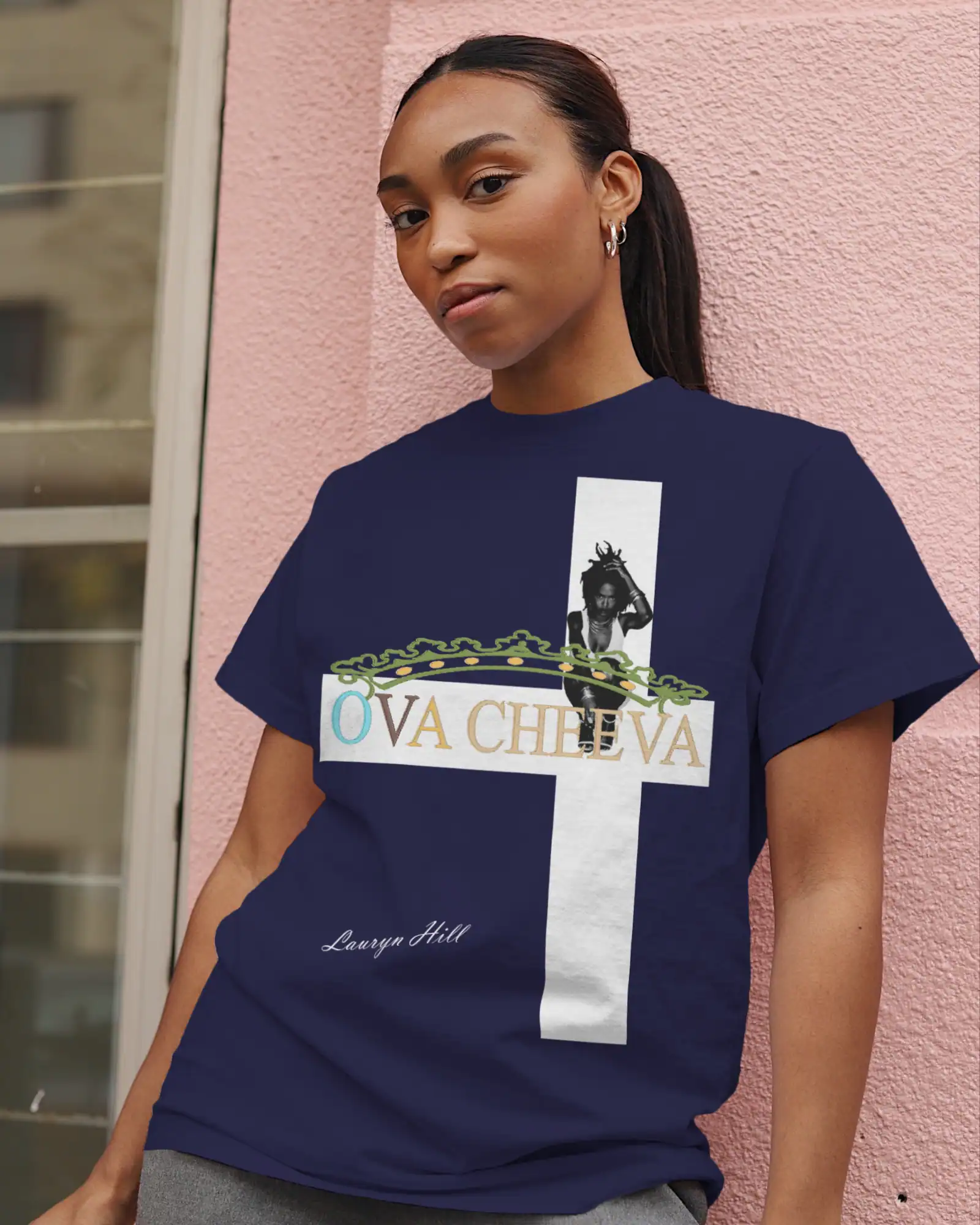 Woman wearing navy T-shirt with "OVA CHEEVA" and Lauryn Hill graphic design.
